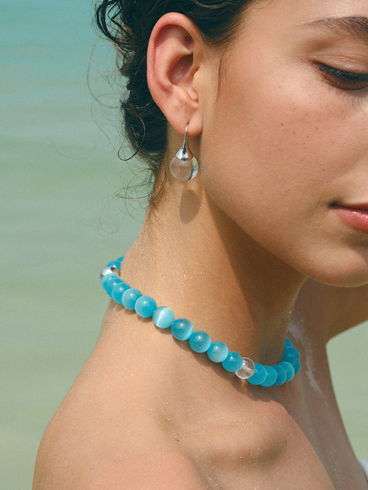 Complete your style with the elegant blue cat's eye stone and bead necklace