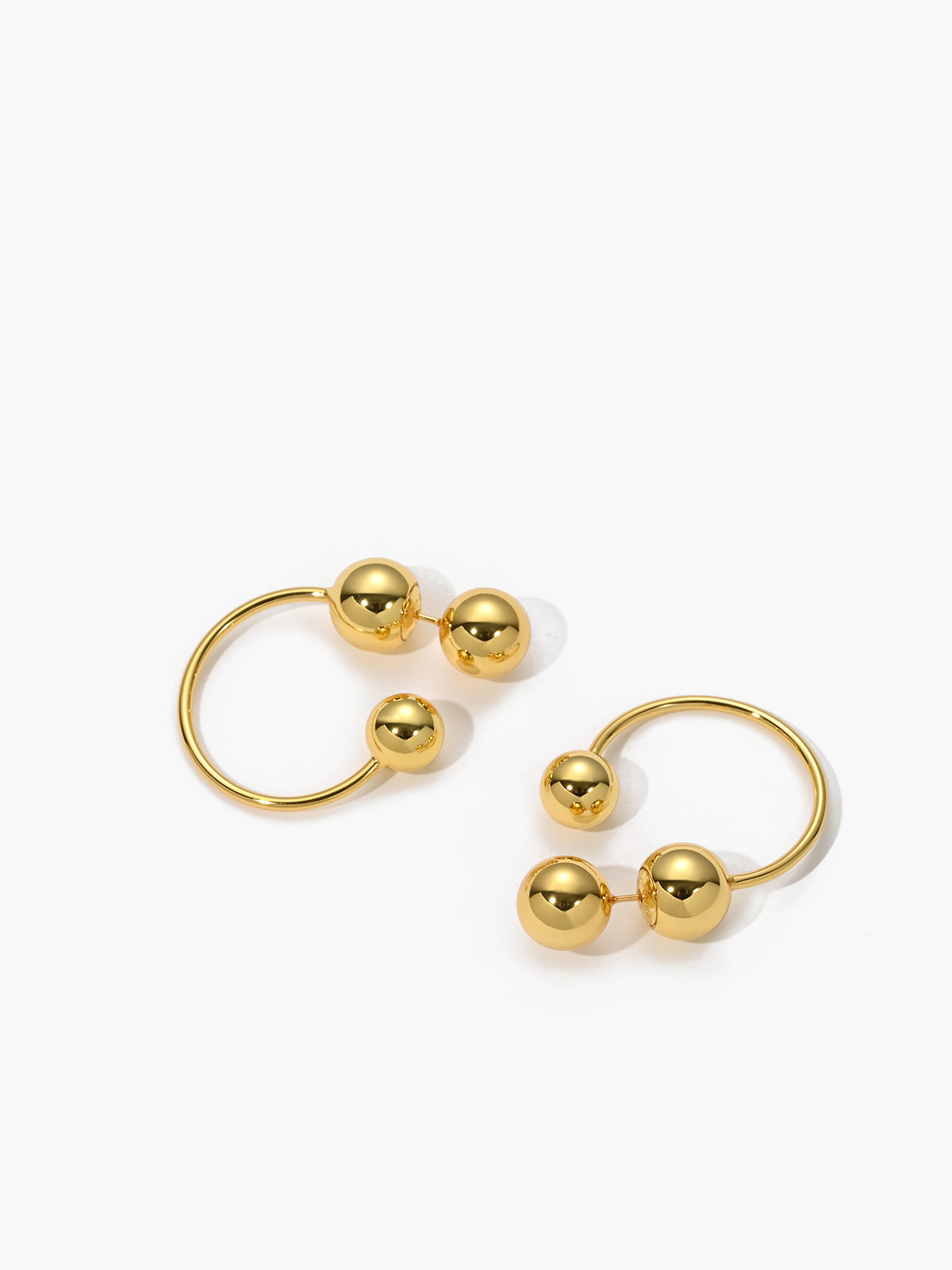 Elegant gold ball studs and earrings for a stylish look