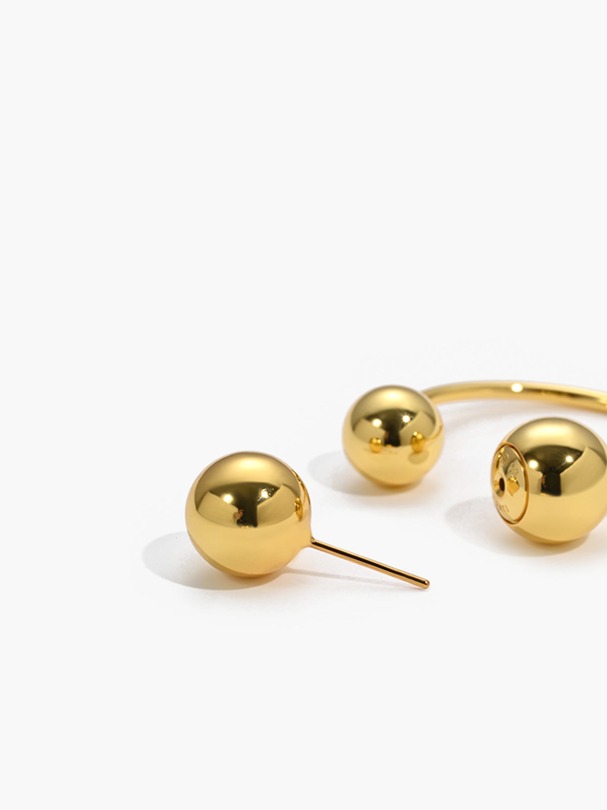Elegant gold ball studs and earrings for a stylish look