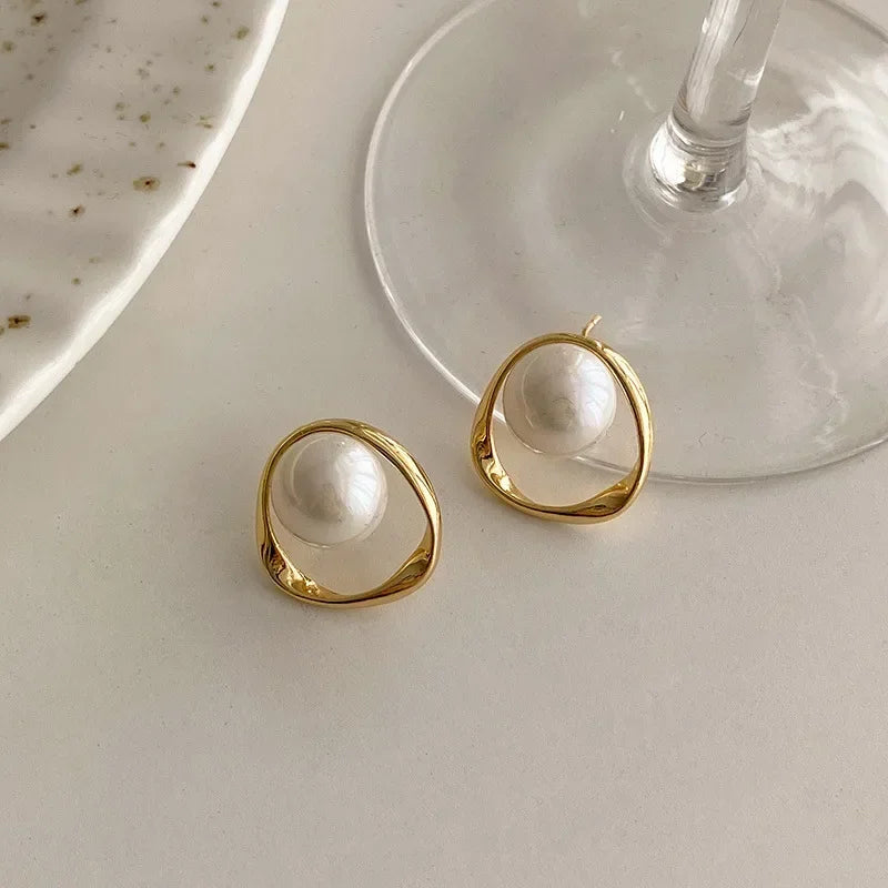 Captured Pearl Earrings in Gold Bezel