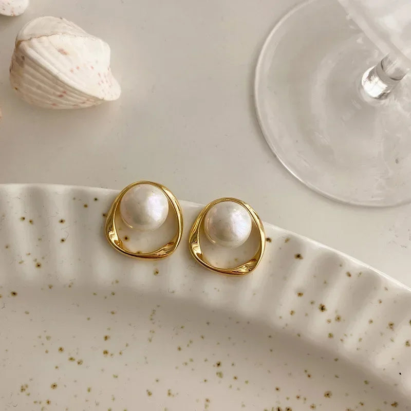 Captured Pearl Earrings in Gold Bezel