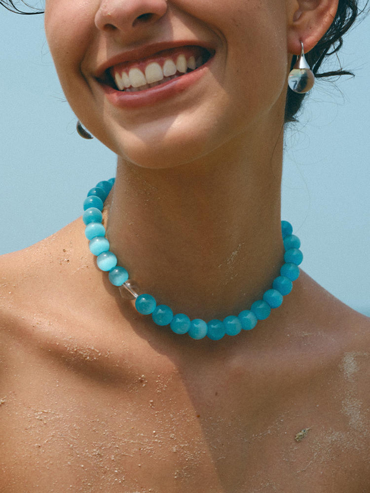 Complete your style with the elegant blue cat's eye stone and bead necklace