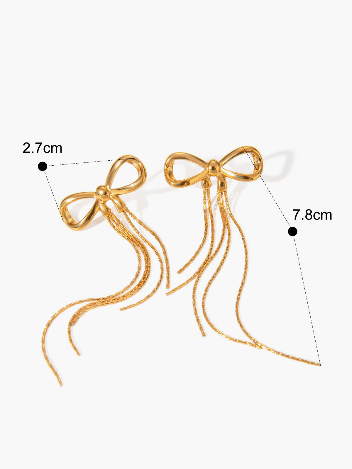 Earring hoops with a shiny gold bow design