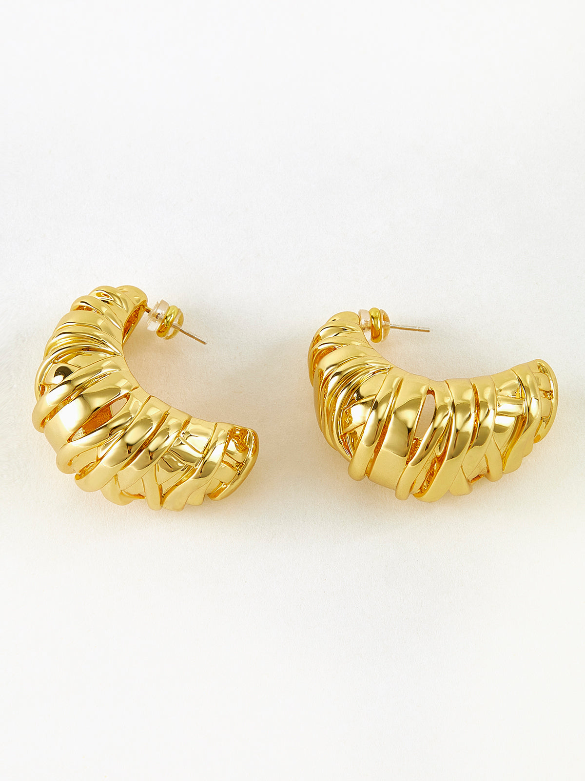 Elegant twisted half-moon gold-colored earrings