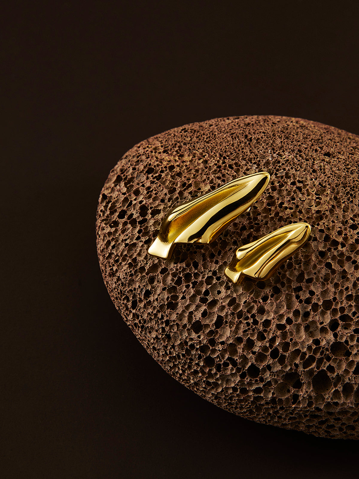 Incomplete asymmetric paper airplane earrings with fine pleats