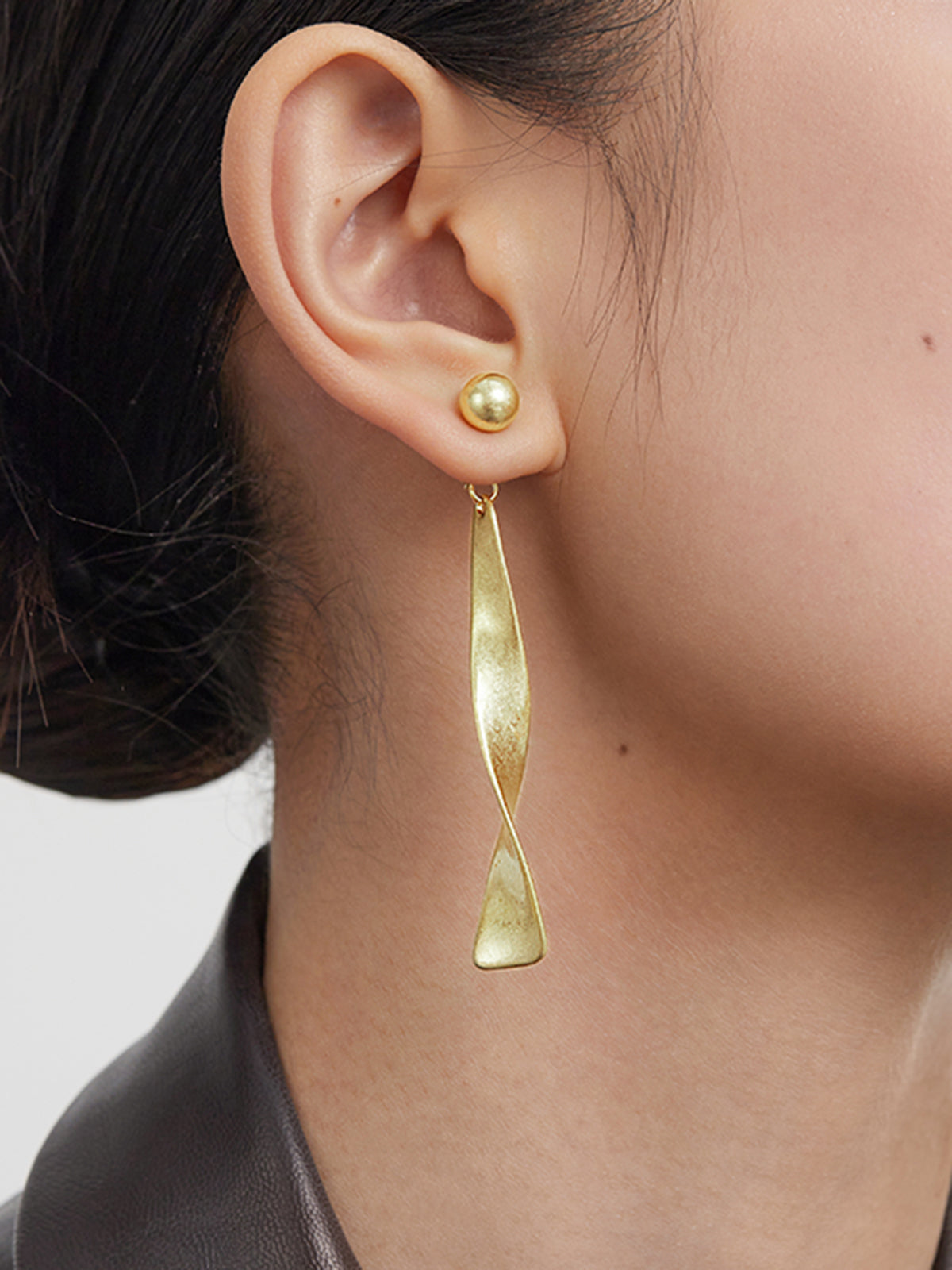 Vintage metal hoop earrings with spiral design