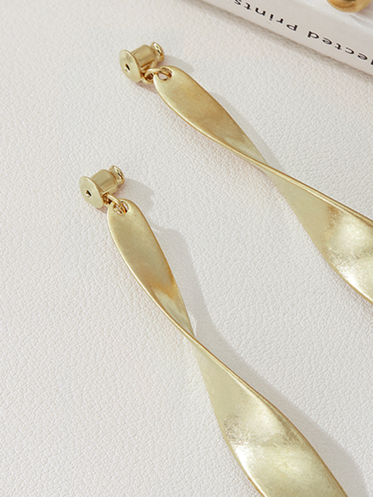 Vintage metal hoop earrings with spiral design