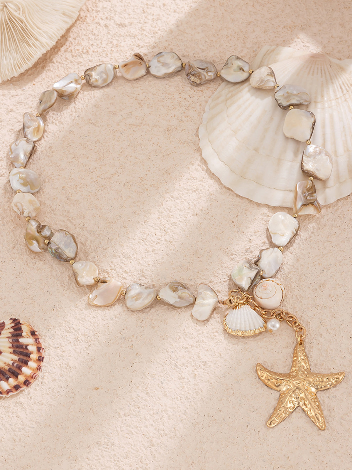 Elegant shell and starfish pendant with pearl necklace for an touch of oceanic charm
