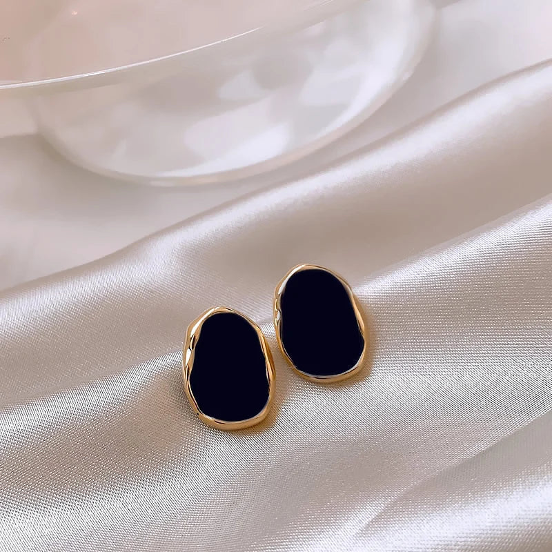 Golden Earrings with Onyx and a Mystical Touch