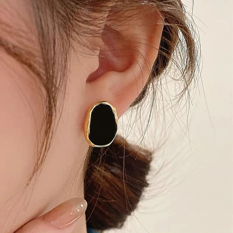 Golden Earrings with Onyx and a Mystical Touch