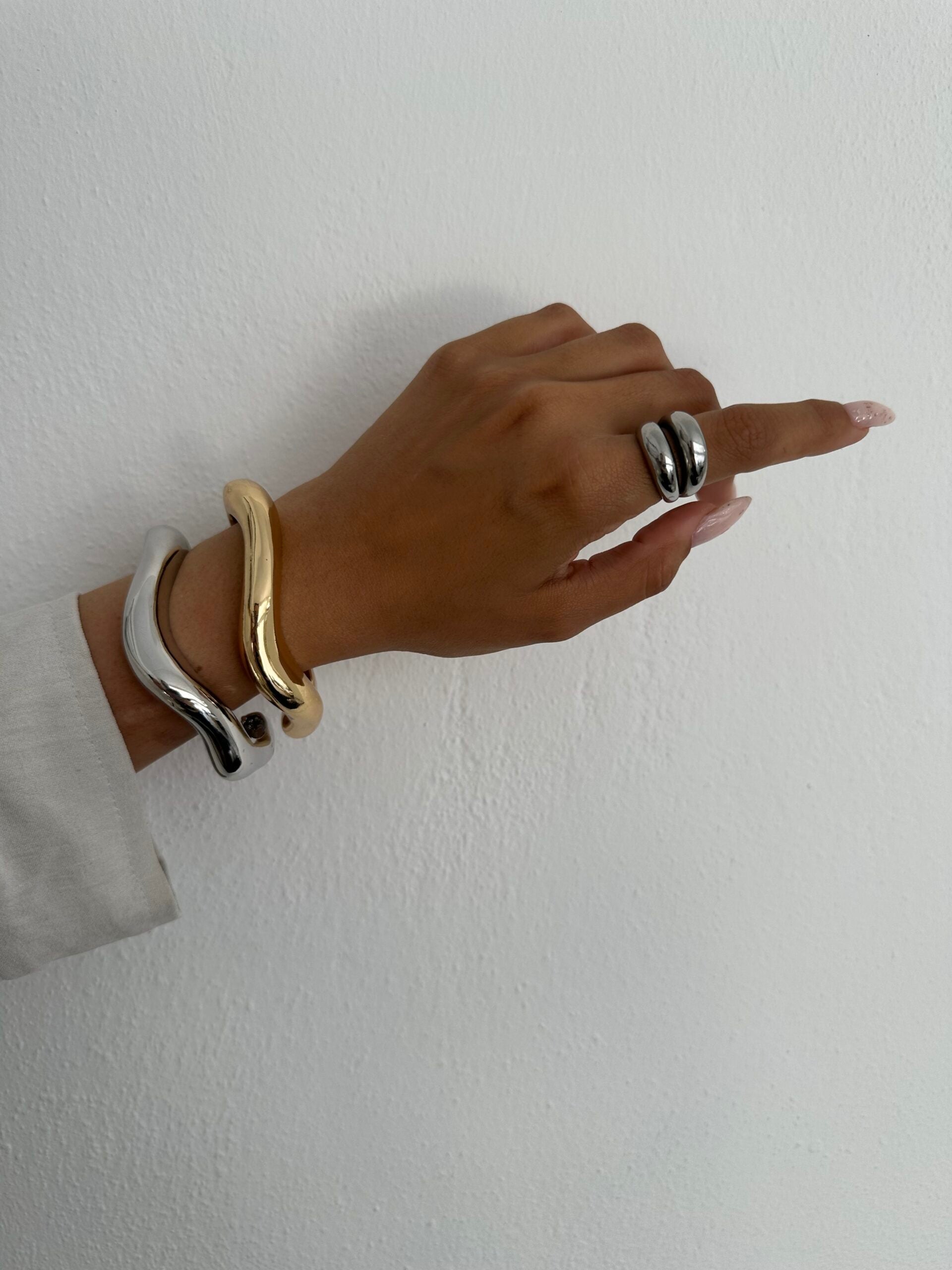Unique asymmetrical bracelet made of metal material for a stylish look